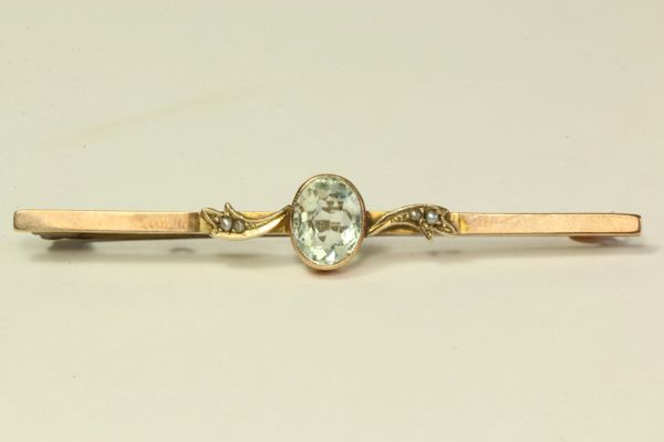 Gold aquamarine and seed pearl stock pin