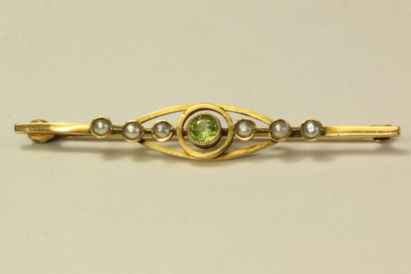 Gold peridot and seed pearl stock pin