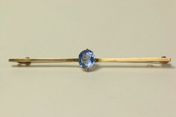 Gold and sapphire stock pin