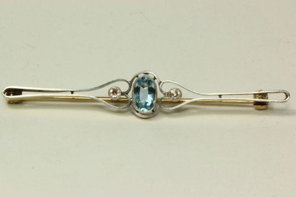 Gold diamond and aquamarine stock pin