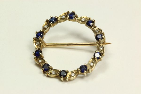 Gold sapphire and diamond stock pin
