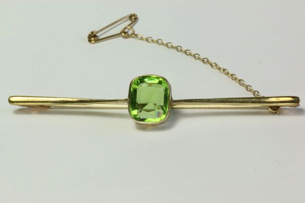 Gold peridot stock pin