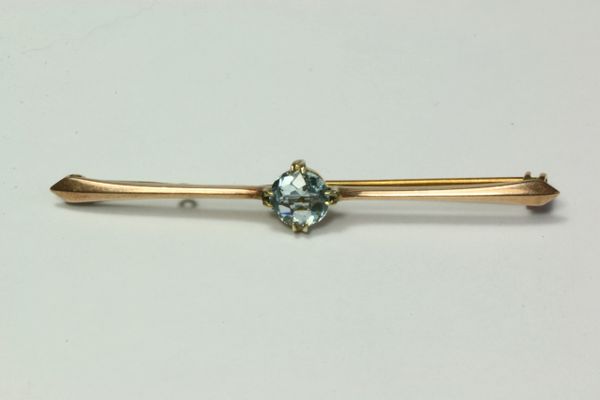 Gold and aquamarine stock pin