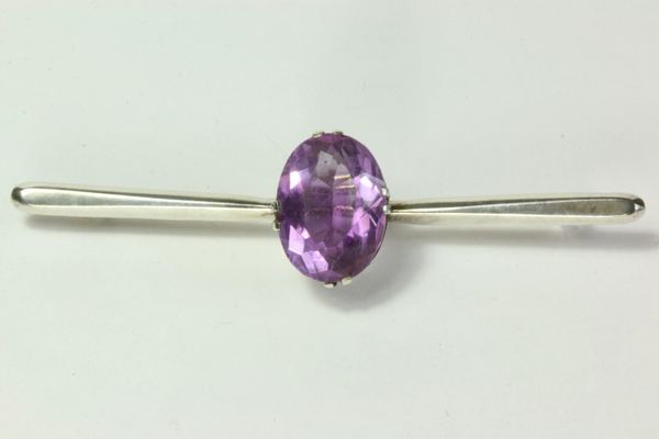 Silver and amethyst stock pin