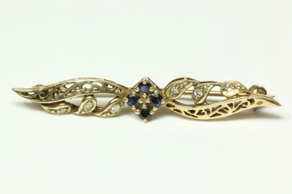 Gold sapphire and diamond stock pin