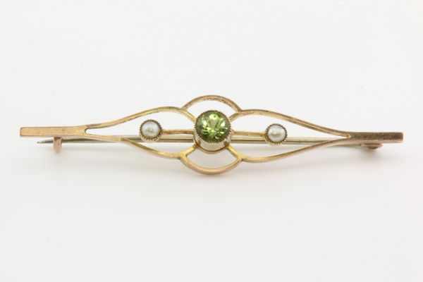 Gold peridot and seed pearl stock pin