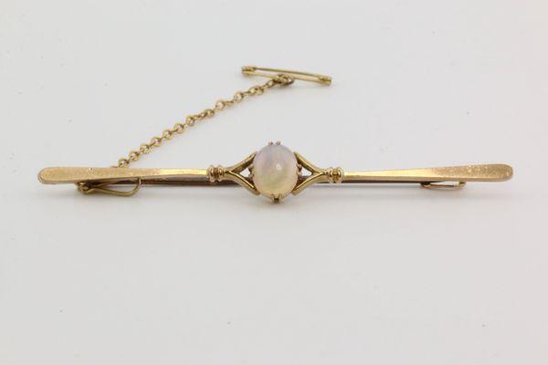 Gold and opal stock pin