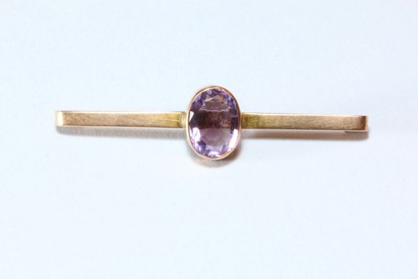 Gold stock pin with large amethyst