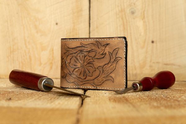 Hand tooled leather wallet made by Jacob of Seventh Wonder Leatherworks