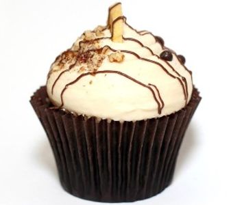 Chocolate Cupcake, peanut butter icing, pecans, chocolate pearls, a banana chip, and chocolate swirl