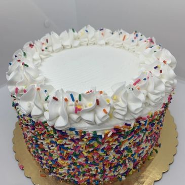 White round cake with confetti sprinkles