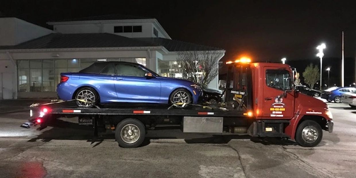 American Towing car breakdown towed on flatbed wrecker in Worcester, MA and Shrewsbury Massachusetts