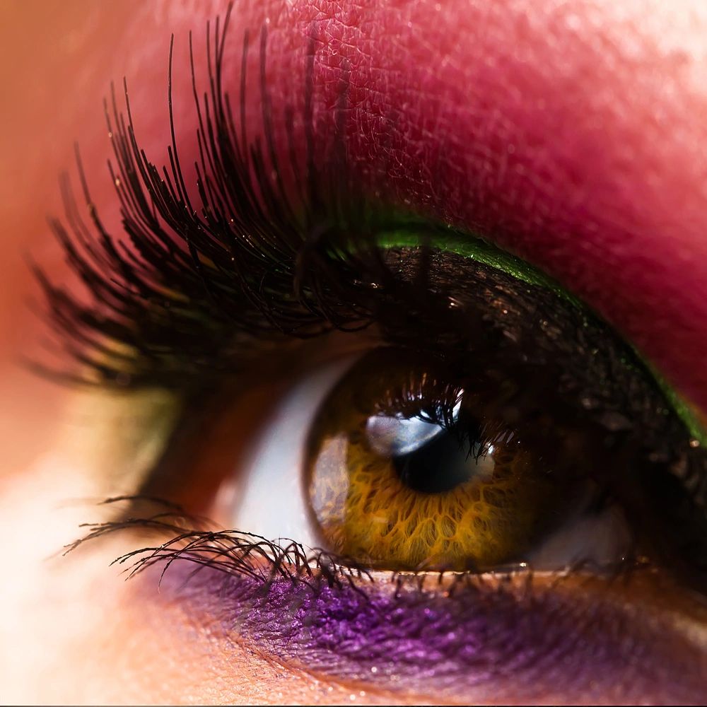 a photo of an eye with magnetic lashes applied to it.