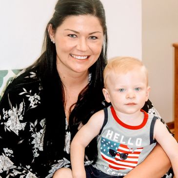 Teacher with toddler on lap.