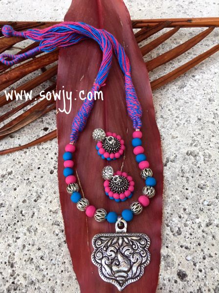 Tibetan silver pendant set with GS Jhumkas dressed in cotton thread and clay beads!!!!