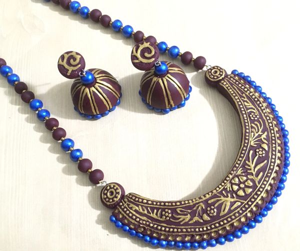 HandMade Curved Embossed Semi Curved Pattern On Clay In Shades of brown and Blue with XL Size Jhumkas!!!!