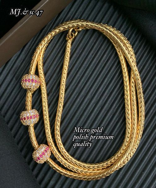AD Stone Balls Design Side Mogappu Pendant in Gold Micro-Polish Chain-Ruby and White!!!!!!