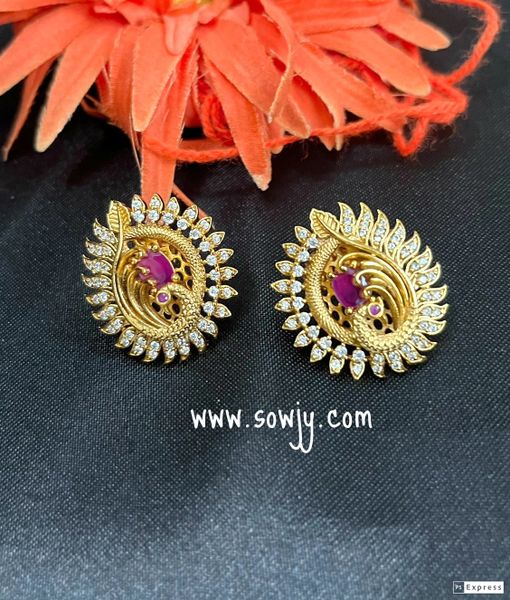 Beautiful Peacock Feather Pattern Gold Finish Earrings- White AD Stones and Ruby!!!