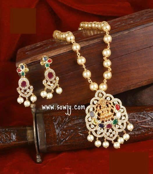 Lovely Navarathna Stone Lakshmi Gold Finish Pendant Set in Long Pearl Maala with Matching Earrings !!!!
