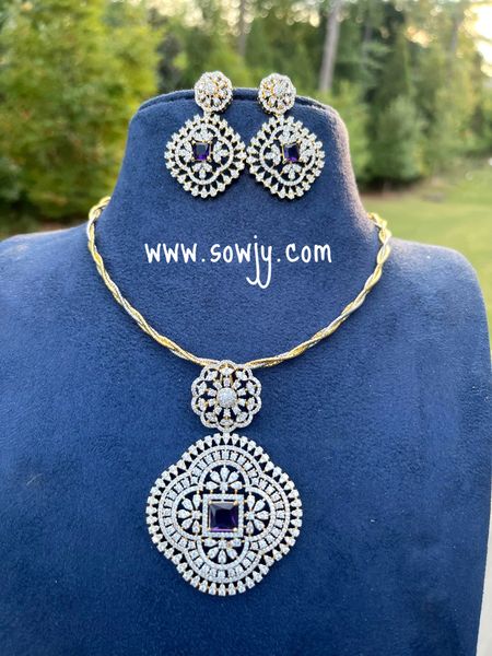 Intricate Designer Work Diamond Look Alike Big Floral Pendant with Big Earrings in A Designer Hasli Dual Tone Twisted Chain - Purple Center Stone!!!