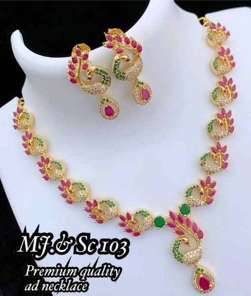 Lovely AD Stone Gold Look Alike Premium Quality Peacock Designer Necklace with Matching Earrings- Ruby ,Emerald and White !!!!