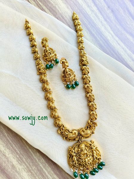 Lovely Lakshmi Big Pendant Nakshi Pattern(3D Embossed) Designer Long Haaram with Earrings in Gold Tone!!!