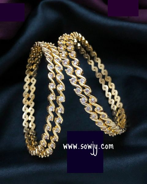 Beautiful Gold Look Alike Curvy Pattern Bangles- White AD Stones- 4 Bangles Count -Size 2.6