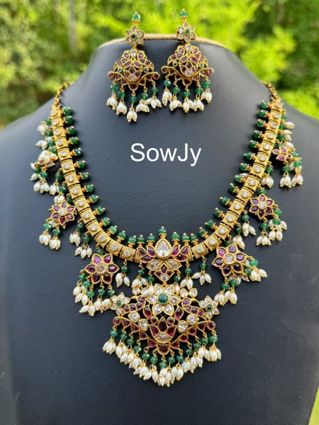 Jadau Replica Real Kemp Stone Lotus Pendant Short Guttapusalu Haaram with Matching Earrings in Gold Finish!