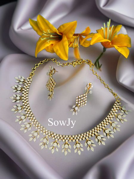 Classy Statement Style Diamond Look Alike Gold Finish Necklace with Designer Earrings