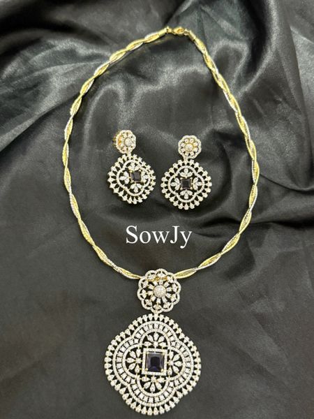 Big Floral Diamond Replica Pendant in Dual Tone Twisted Hasli Necklace with Big Light Weighted Earrings- Purple !!!!