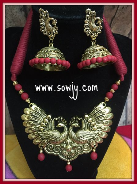 Grand Designer Big Peacock pendant with Large Sized Peacock Jhumkas in Shades of Red!!!!
