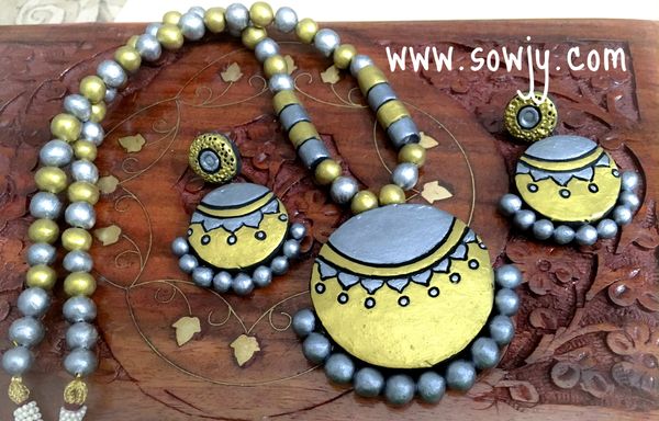 Trendy Designer Terracotta Set with Grand Earrings in Silver and Gold!!!!