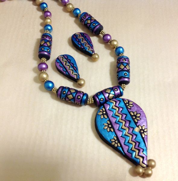 Handcarved Design in peacock Purple and Blue design with studs!!!!!!!!
