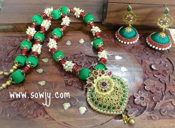 Designer Antique Pendant Silk Thread Set with Matching Jhumkas in Shades of red and Green!!!!