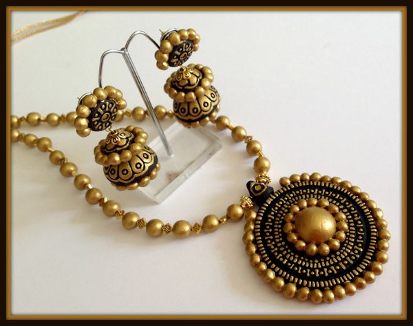 Hand Carved Designs In Black and Gold with light weighted Double Jhumkas!!!!!