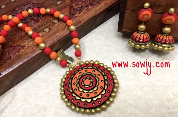 Lovely Designer terracotta Flower pendant necklace with Large Sized Jhumkas in Shades of Orange and Red!!!!!!