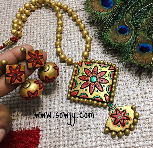 Grand Designer Floral terracotta Squared pendant and Jhumkas in Shades of Gold!!!