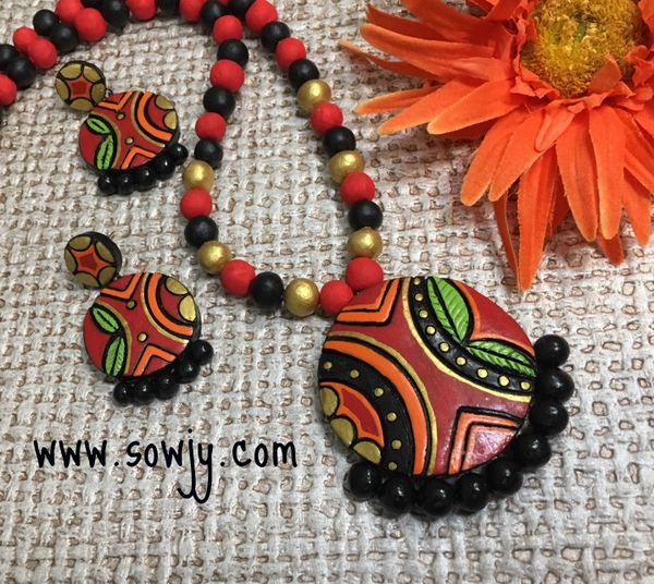 Trendy Terracotta Circle Floral and leaf pendant set in Shades of Red,Black and Gold!!!!