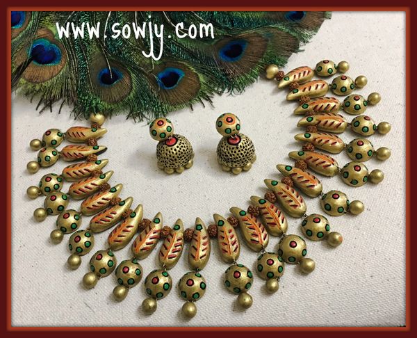 Designer and Grand Terracotta leaf Choker necklace with medium sized Jhumkas in Shades of Gold!!!!