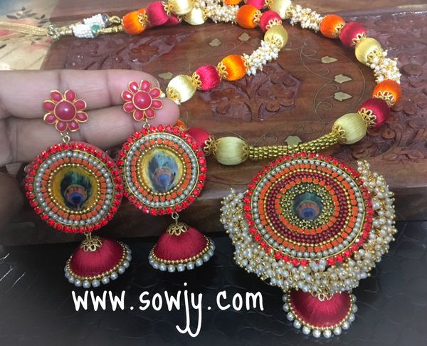 Grand Designer peacock Silk Thread Sets with Light weighted Jhumkas in Shades of red,Ornage and Light Gold!!!