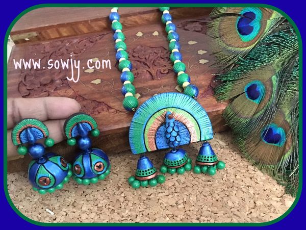 Very Grand And Intricate Designed Peacock pendant with Matching Peacock Large Sized Jhumkas in Shades of Metallic Blue and Green!!!!