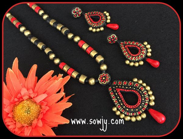 Trendy Tear Drop Designer pendant and Earrings- SHades of Red,Gold and Black!!!!