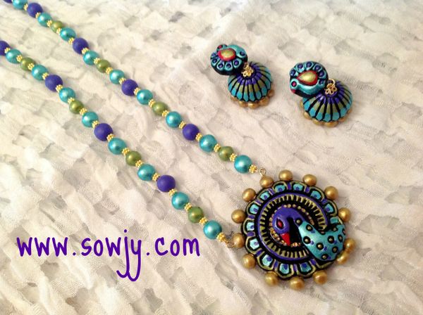 HandCarved terracotta Peacock in Shades of Blue and Green!!!!!