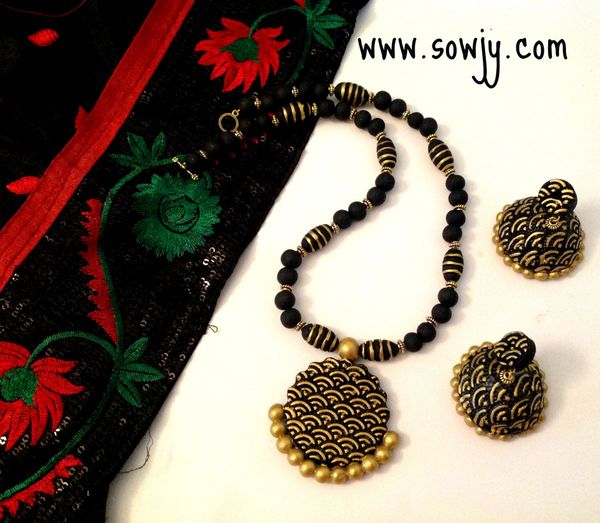Self Embossed Deisgn in Black and Gold with Embossed Jhumkas!!!!!