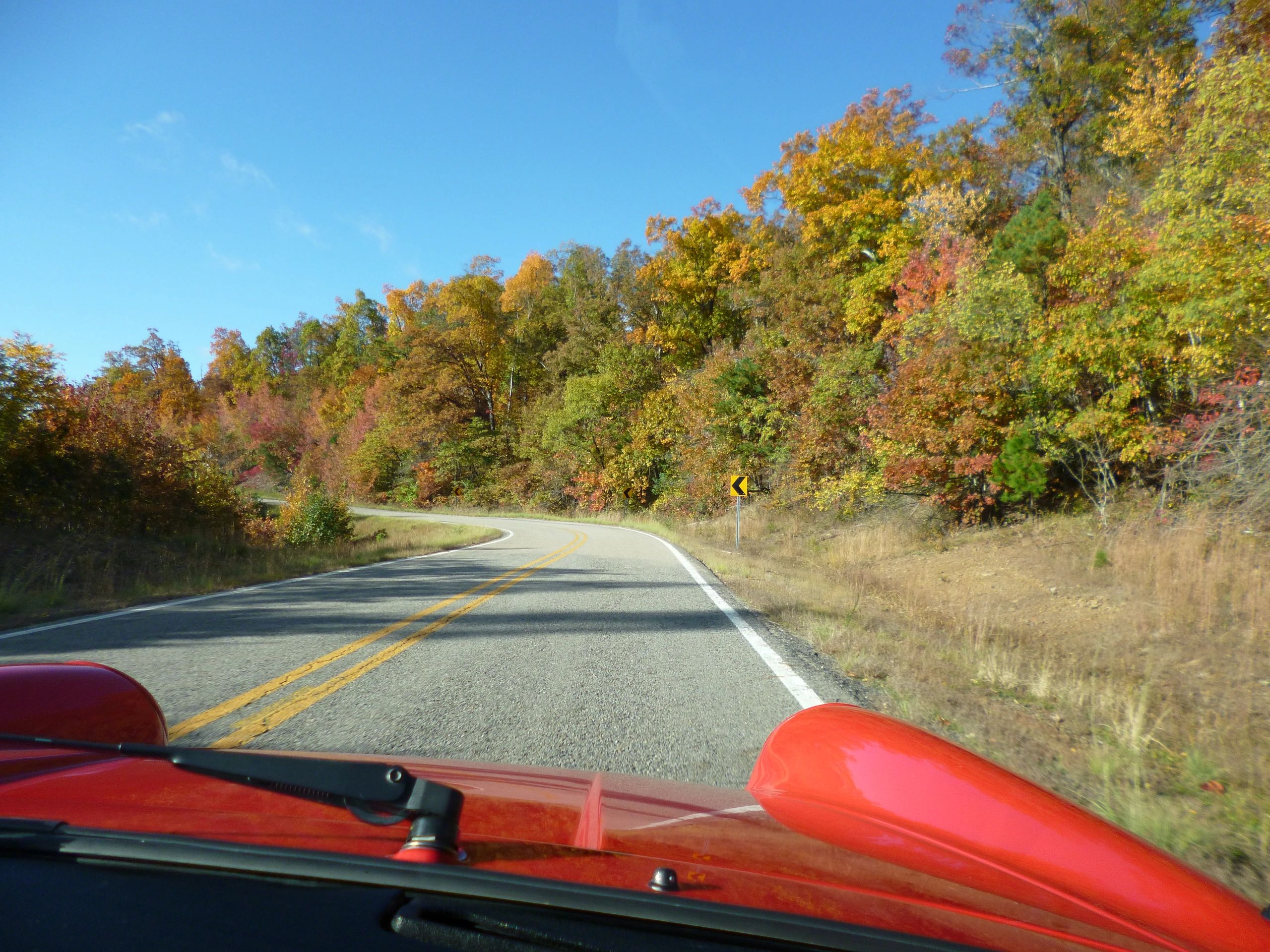 passenger view riding in a red Porsche 911