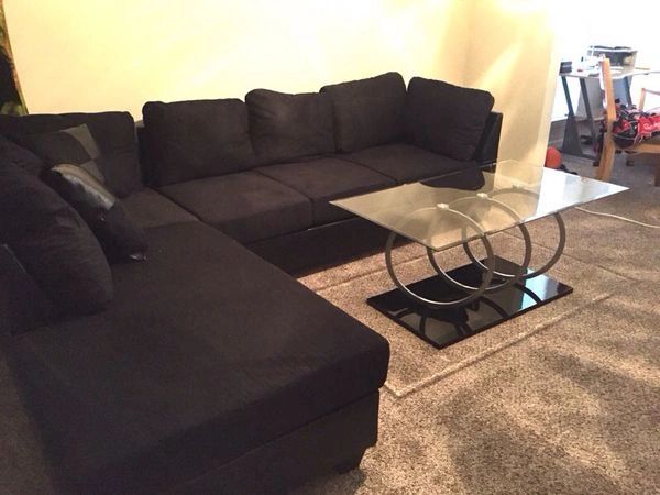 Black microfiber sectional with black leather base 